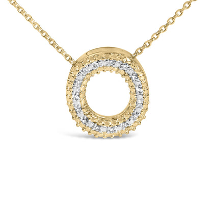 Close-up front view of a yellow metal circular pendant necklace featuring a double circle design with white gemstones set in a prong setting.
