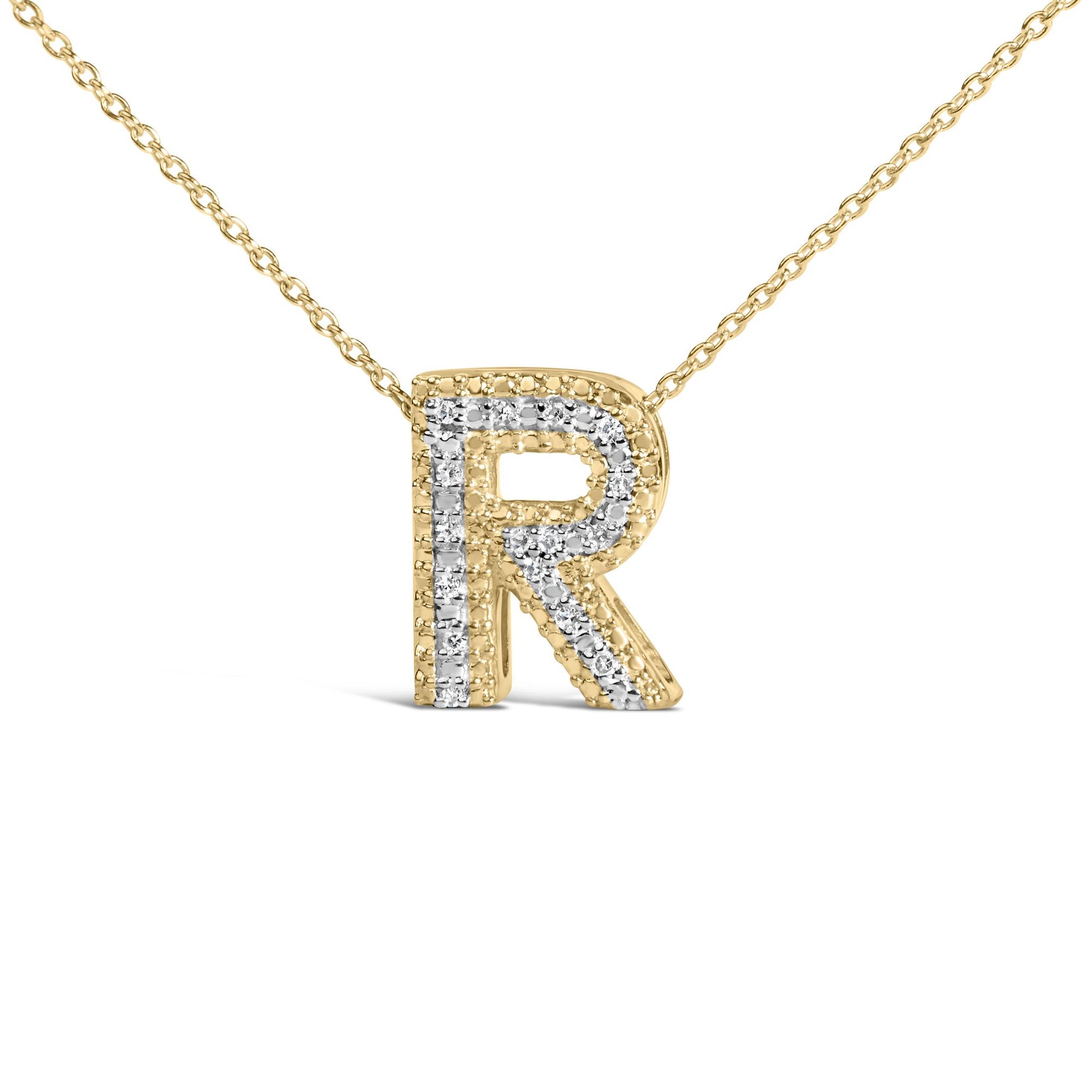 Close-up front view of a yellow necklace with a letter R pendant outlined and detailed with white gemstones in prong settings.
