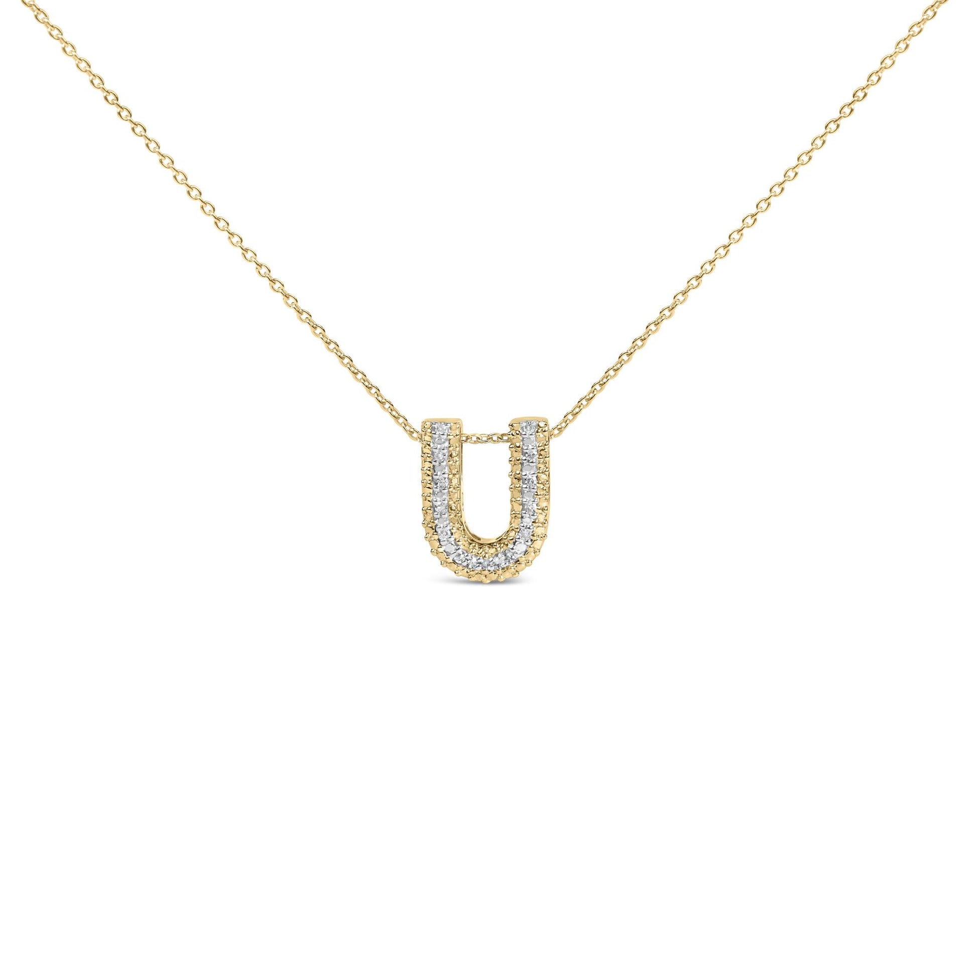 Close-up front view of a yellow metal necklace with a U-shaped pendant featuring a double row of white gemstones in prong settings along the edges, shown on a white background.