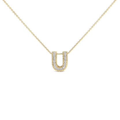 Close-up front view of a yellow metal necklace with a U-shaped pendant featuring a double row of white gemstones in prong settings along the edges, shown on a white background.