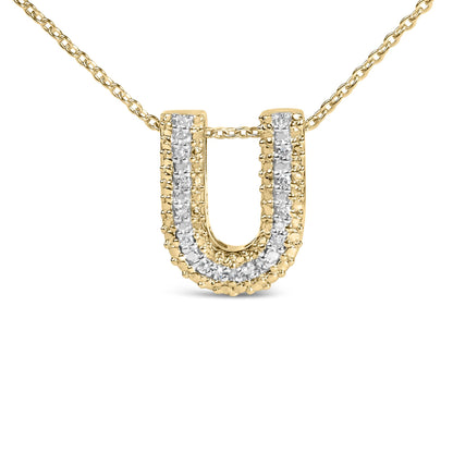 Close-up front view of a yellow metal necklace with a U-shaped pendant featuring two rows of prong-set white round gemstones.
