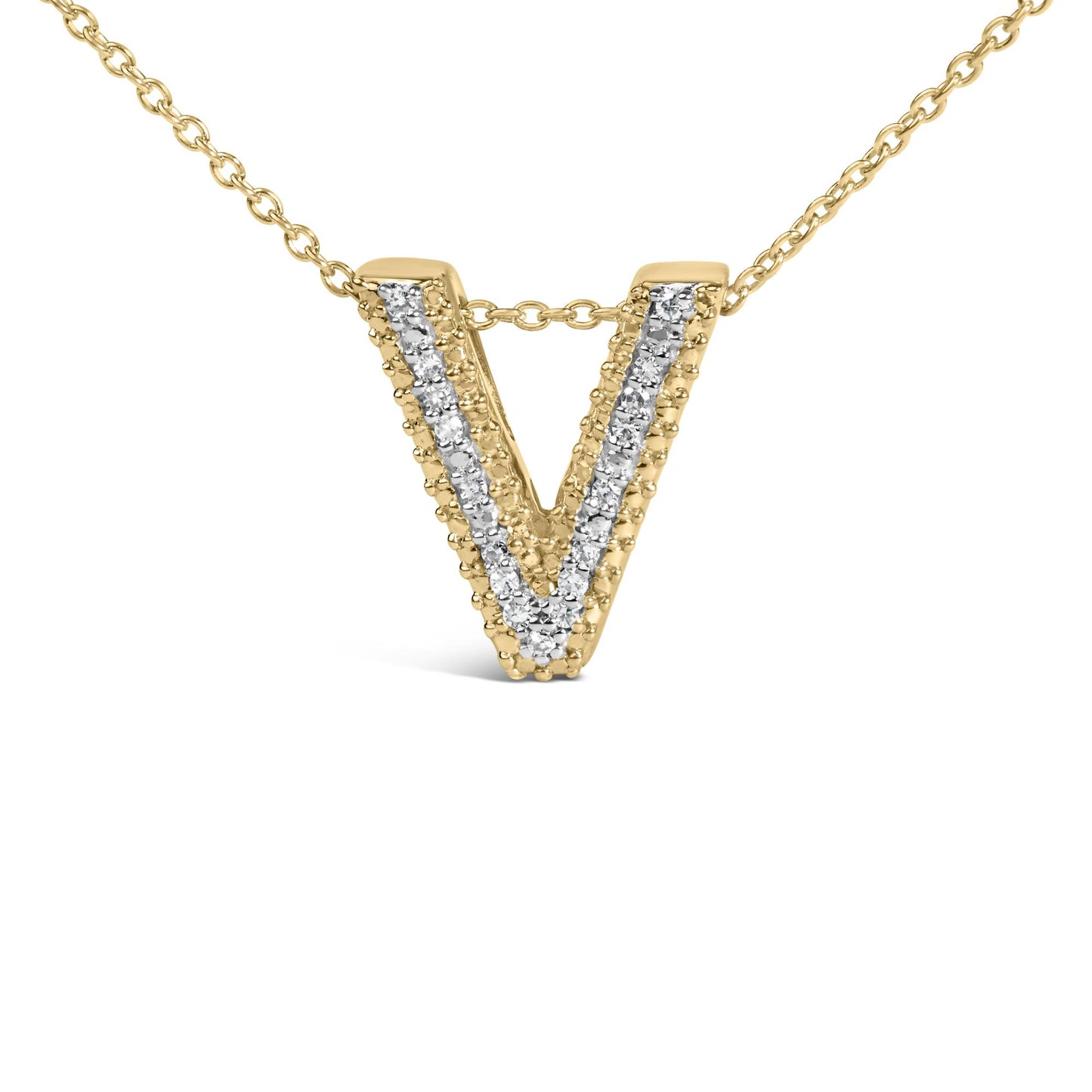 Close-up front angle of a yellow metal necklace pendant in the shape of a letter V, adorned with a row of white round gemstones set in prongs down the center.