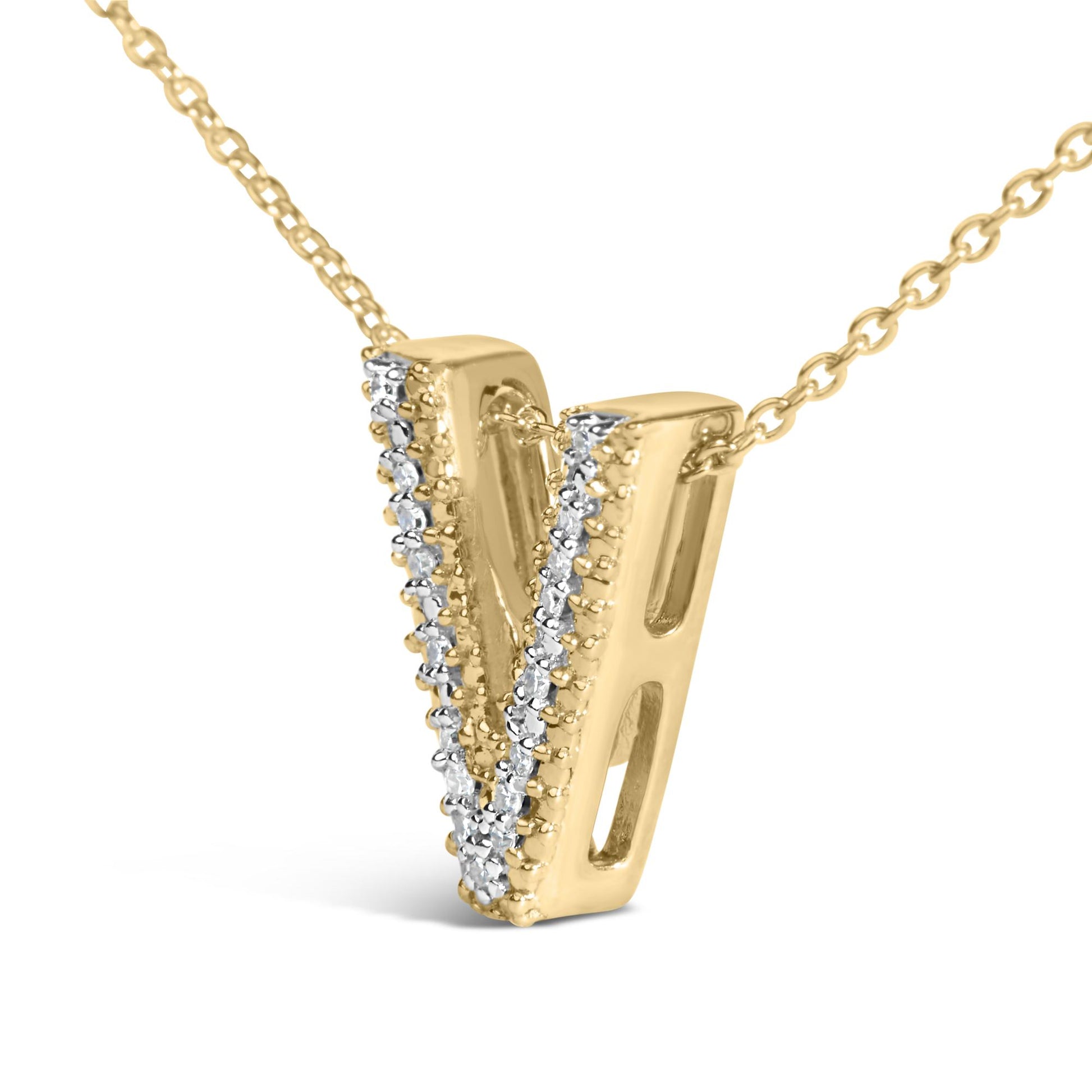 Close-up front angle of a yellow metal necklace pendant shaped like the letter 'V' adorned with vertical rows of small round white gemstones in prong settings.