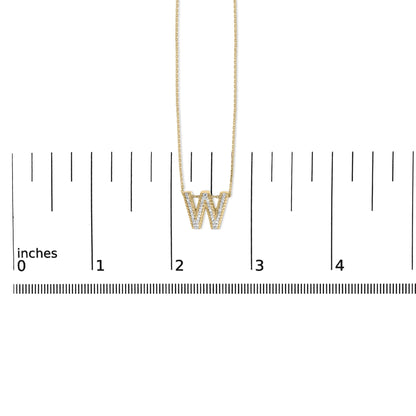 Yellow necklace with a pendant shaped as the letter W, featuring white gemstones in prong setting, shown on a scale from top front angle.