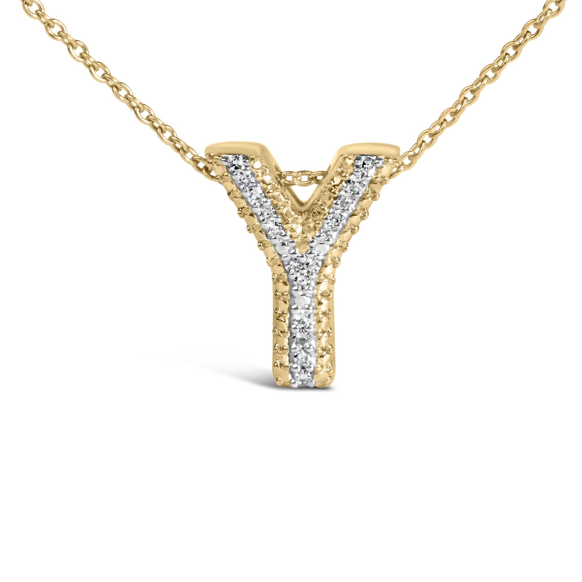Close-up front view of a yellow necklace with a V-shaped pendant featuring a row of prong-set white gemstones down the center.