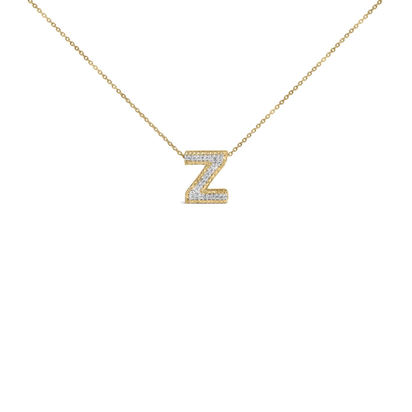 Close-up front view of a yellow metal chain necklace with a pendant in the shape of the letter Z, featuring white round gemstones in prong settings.
