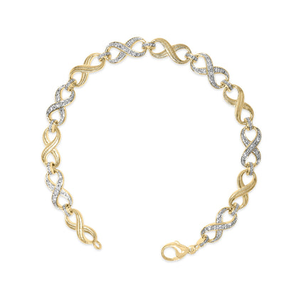 Yellow metal bracelet with alternating textured and pave-set white gemstone infinity links, lobster clasp, shown from top angle.