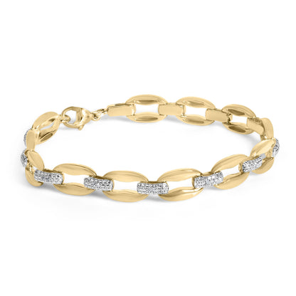 Close-up angled shot of a yellow bracelet with oval links, featuring rectangular sections with white gemstones in pave setting.