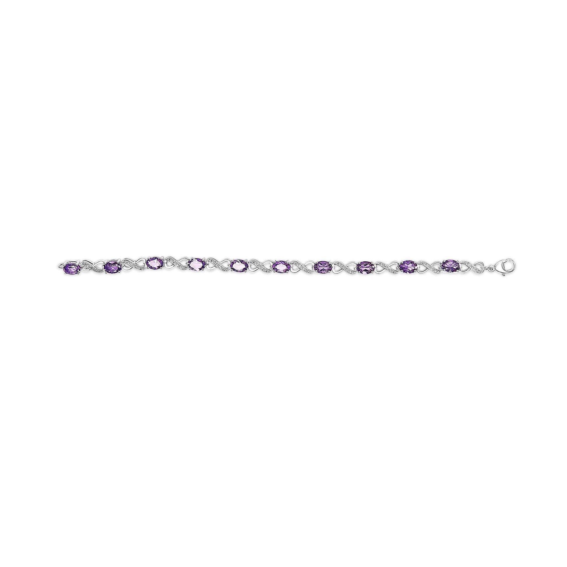 White metal bracelet with alternating oval purple gemstones and round white gemstones in prong settings, shown in a flat lay top-down view.
