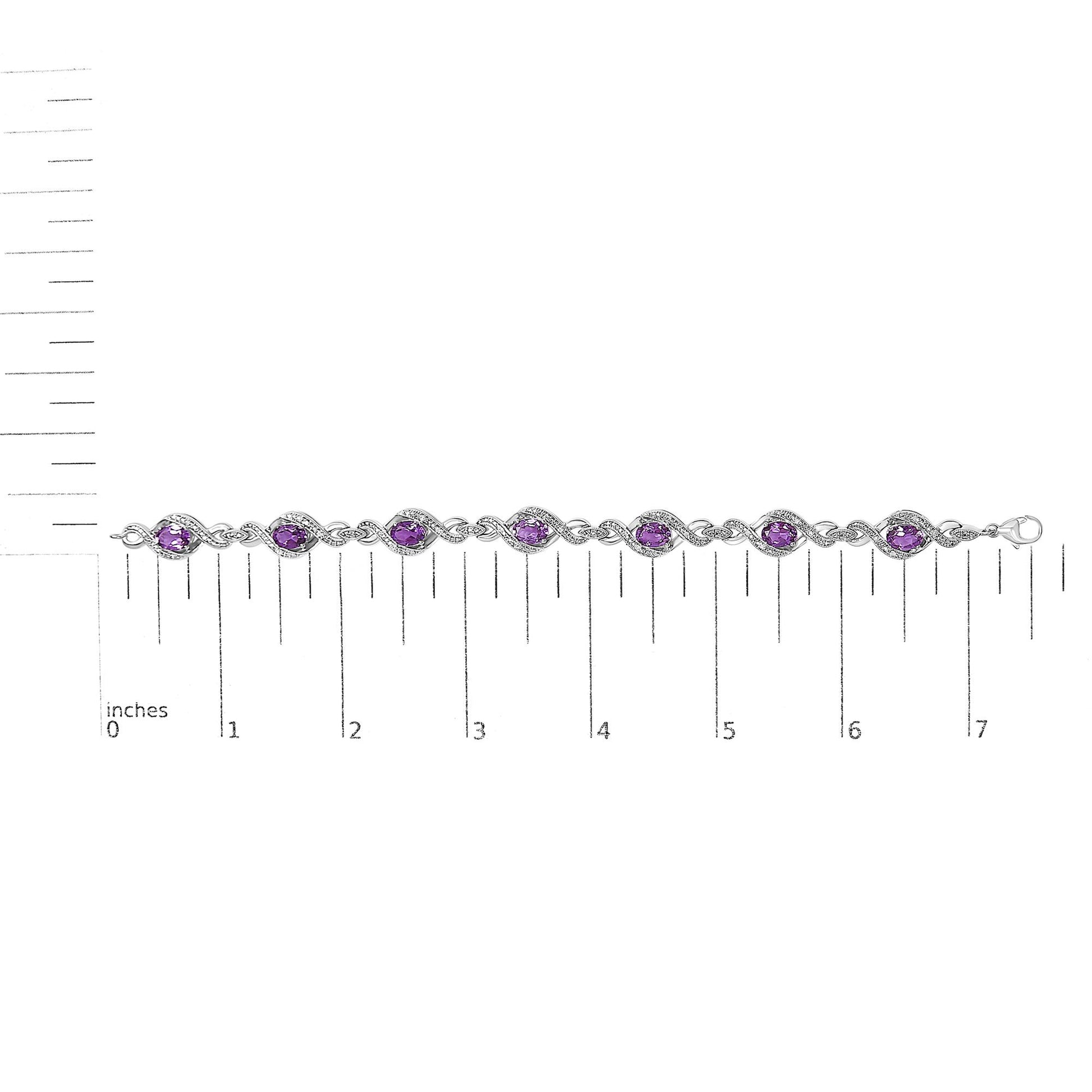 White bracelet with alternating oval purple gemstones and round white gemstones in prong settings, shown on a scale in a top-down view.
