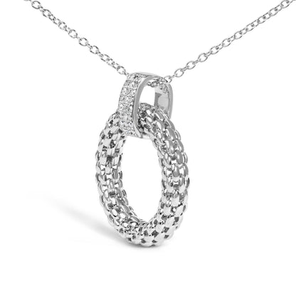 Close-up front angled shot of a white metal necklace with an interwoven loop pendant featuring a micro-pave setting of round white gemstones on one loop.