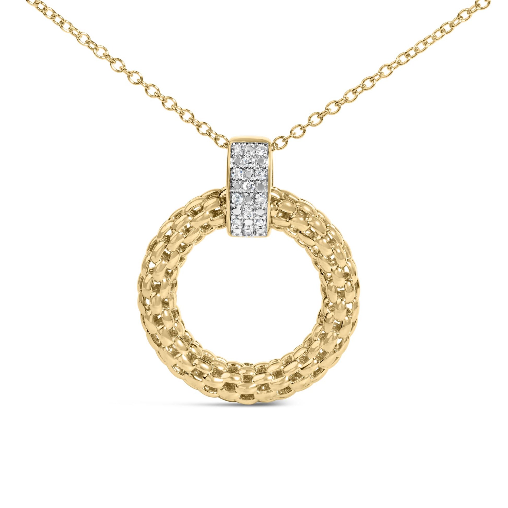 Close-up front view of a yellow necklace with a circular woven pendant and a vertical bar paved with small white gemstones.