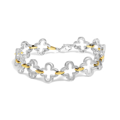 Bracelet shown from a slight side angle, featuring alternating white and yellow metal linked in a clover-like shape, with white gemstones in a pave setting along the white metal parts.