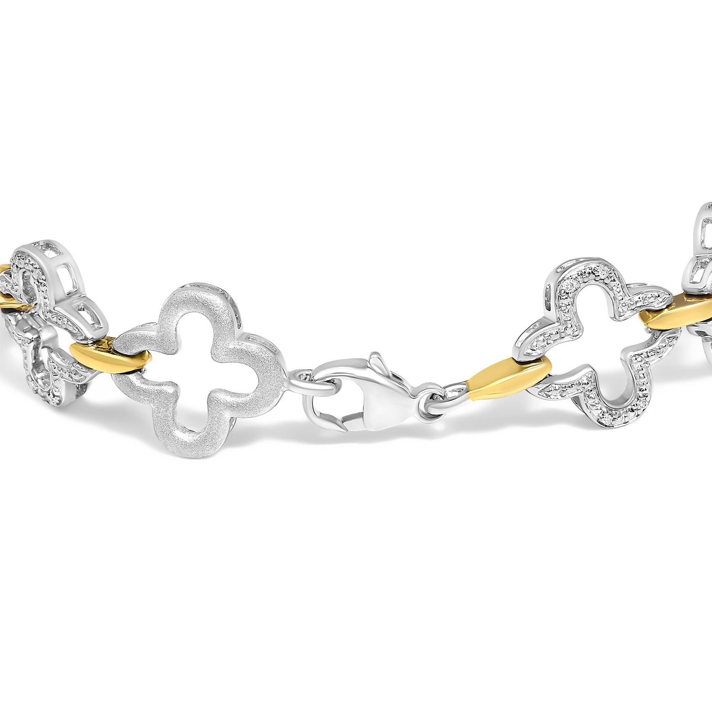 Close-up side angle of a bracelet featuring alternating white and yellow metal quatrefoil-shaped links, with some white links adorned with pave-set round white gemstones, shown on a white background.
