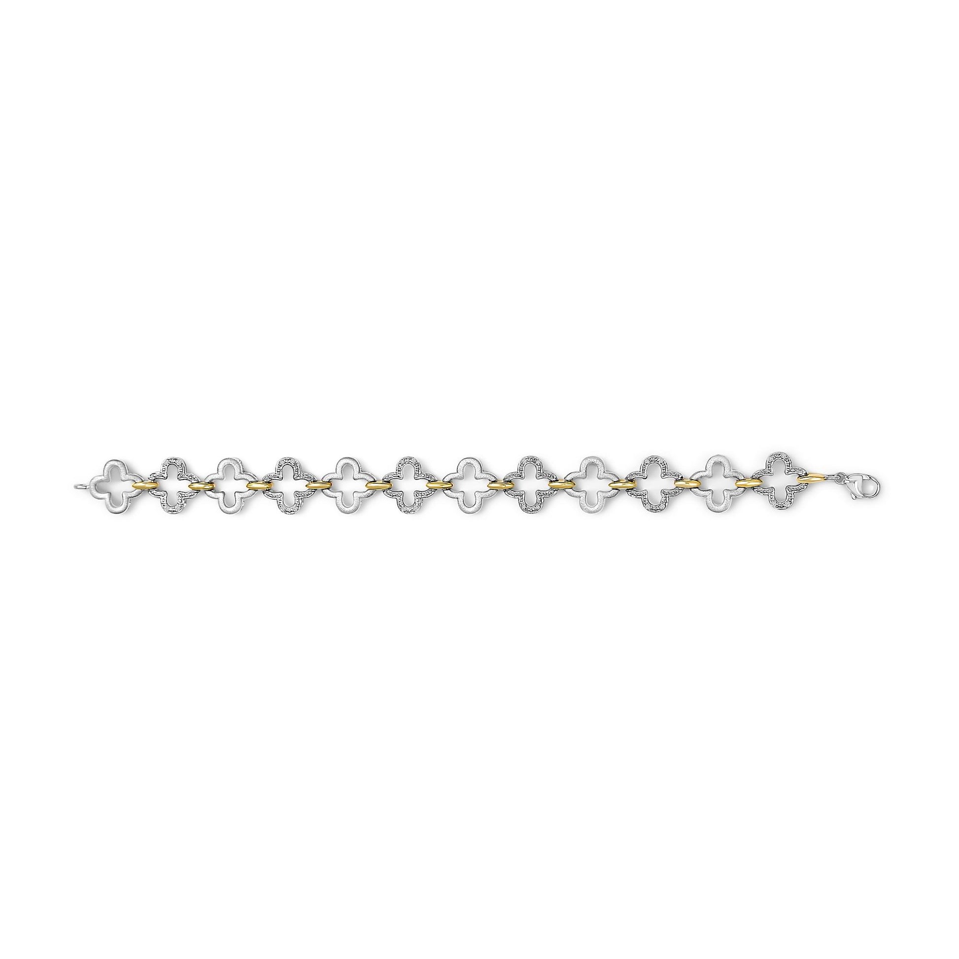 Top-down view of a bracelet with alternating yellow and white metal links shaped like abstract flowers, each white link featuring multiple small white gemstones in a pave setting.