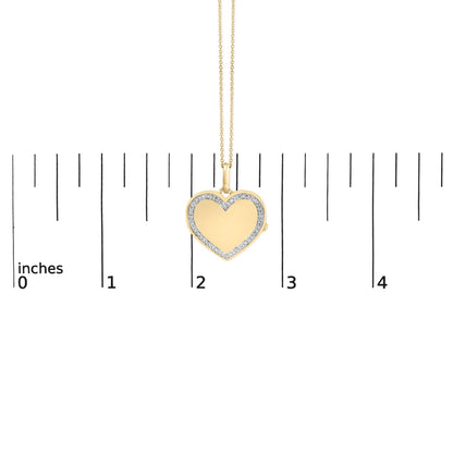 Close-up front view of a yellow necklace with a heart-shaped pendant bordered by white gemstones, shown on a scale.