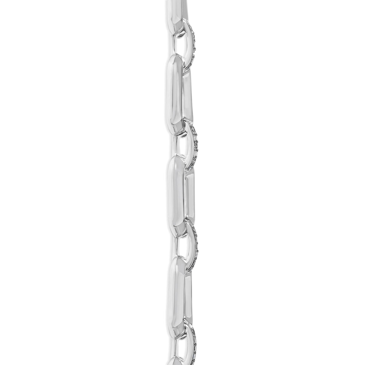 Close-up side view of a white metal necklace chain with alternating smooth and pave-set white gemstone links.