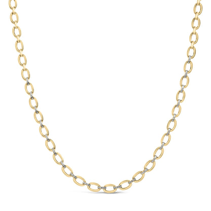Close-up front angle of a yellow metal chain necklace with alternating links, some set with small white gemstones in a pave setting.