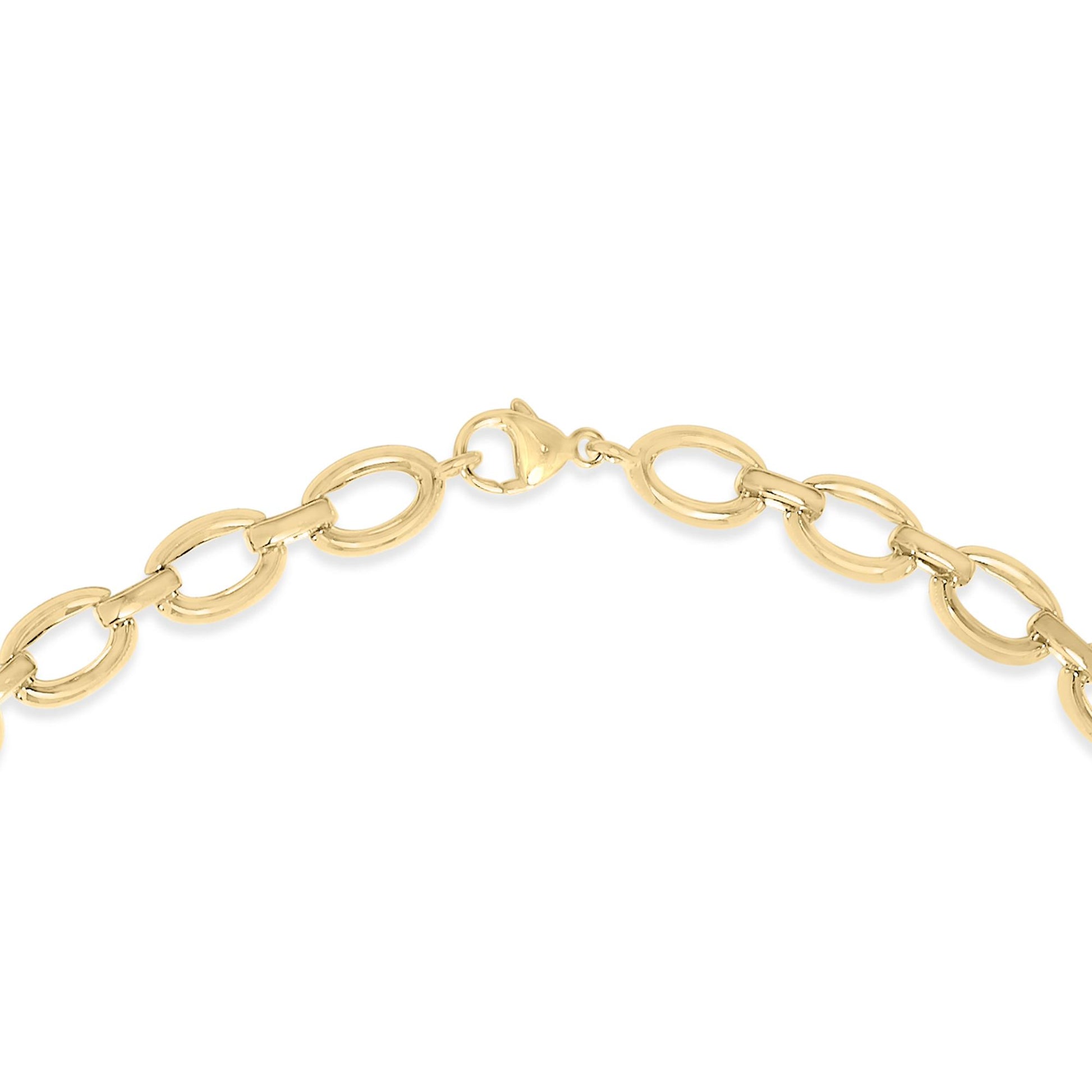 Close-up front view of a yellow metal necklace with large oval links and a lobster clasp, shown on a white background.