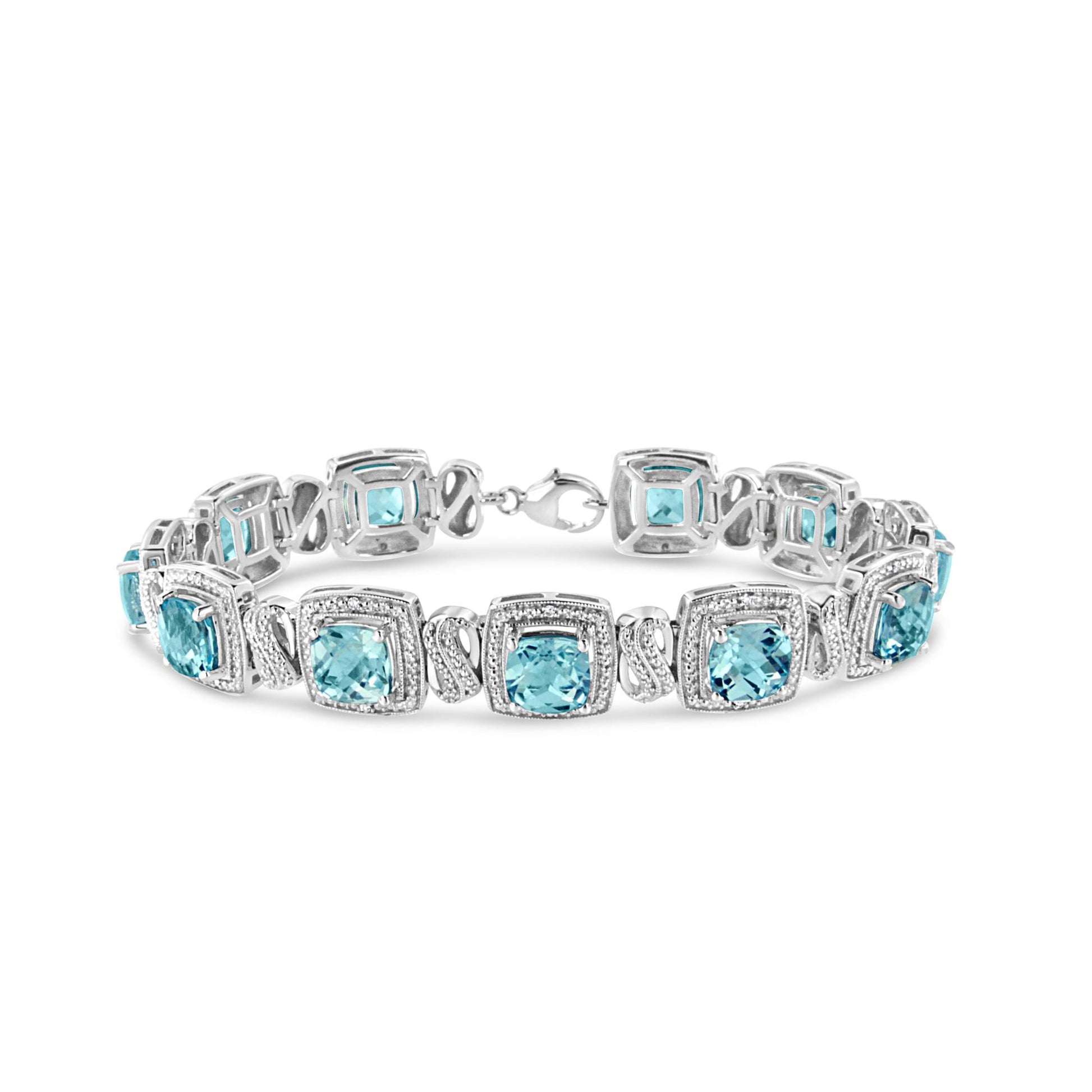 Front angle of white metal bracelet featuring square blue gemstones set in prongs, alternating with sections of pave-set round white gemstones.