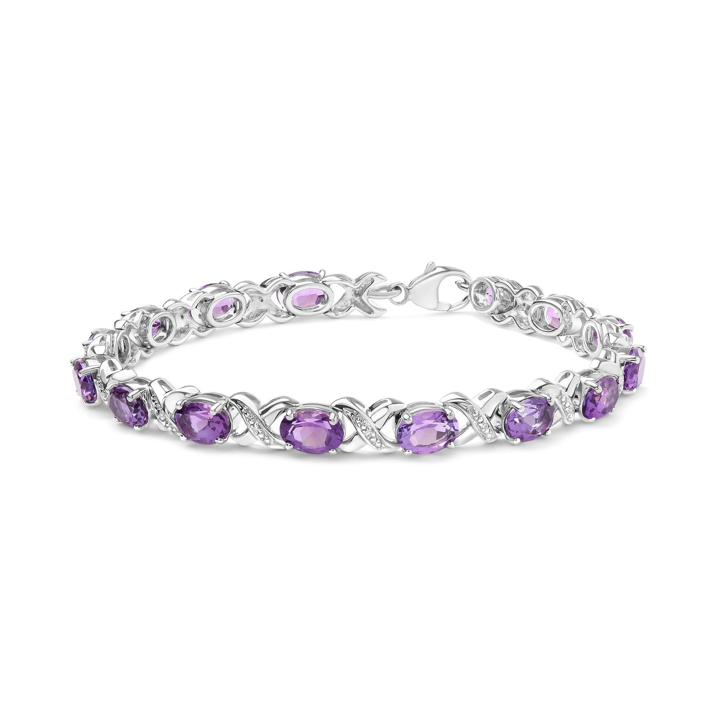 Bracelet in white metal with purple gemstones and white round gemstones in prong settings, shown in a close-up side angle.