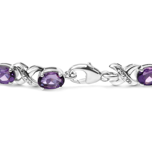 White metal bracelet with alternating oval purple gemstones and white gemstones in an intertwined design, shown in a close-up side view.