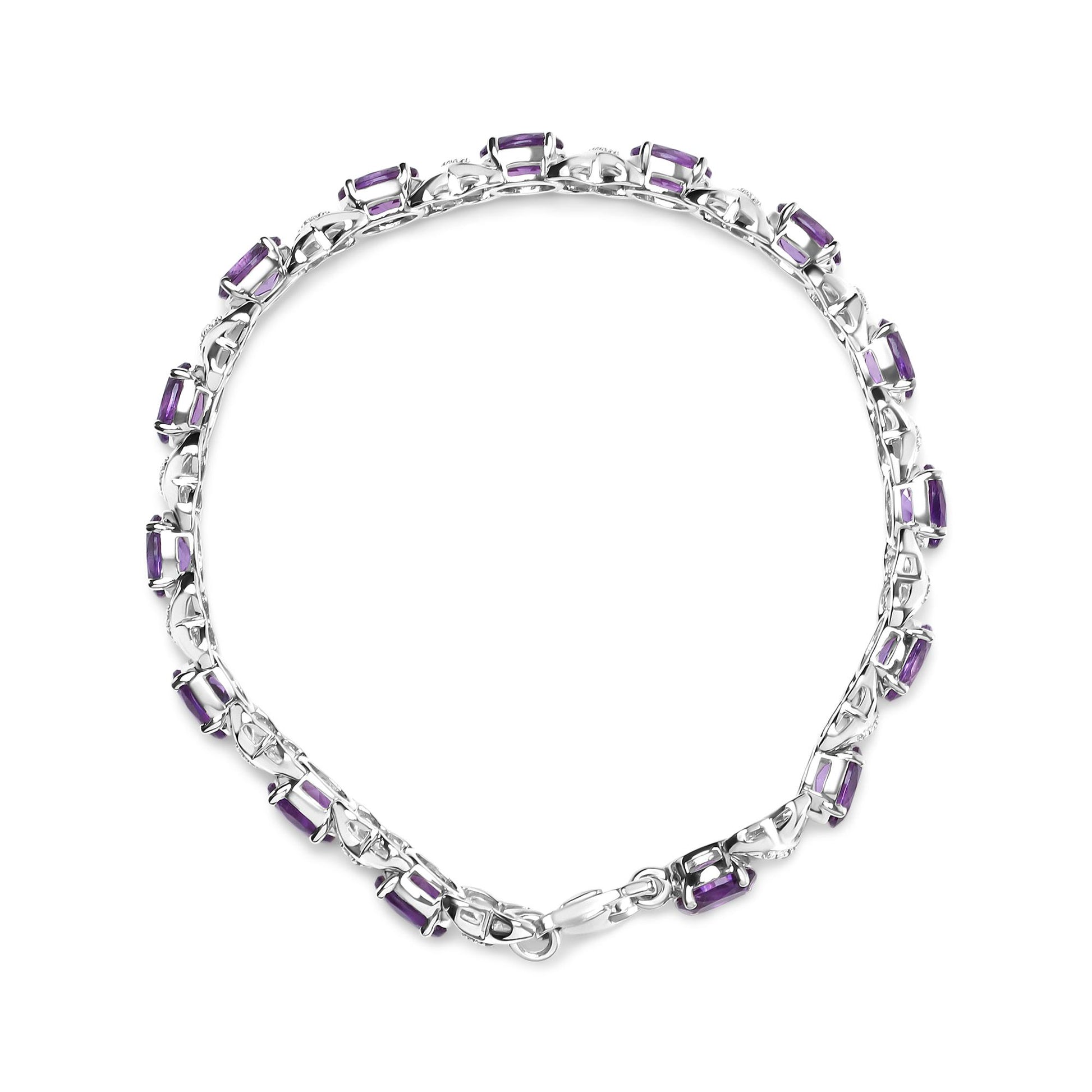 Top-down view of a white metal bracelet featuring rectangular purple gemstones and round white gemstones in prong settings along the band.