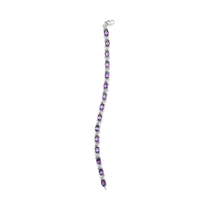 White metal bracelet with alternating purple and white gemstones in prong settings, shown flat from a top-down angle.