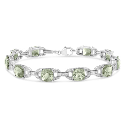 White metal bracelet with green cushion-shaped gemstones and white round gemstones in prong settings, shown in a front-facing angle on a white background.