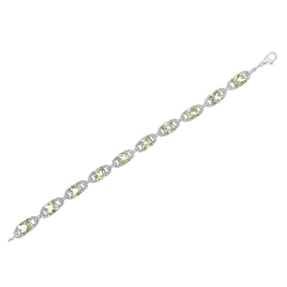 White metal bracelet with alternating square green gemstones and small round white gemstones in prong settings, shown from an angled top view on a white background.
