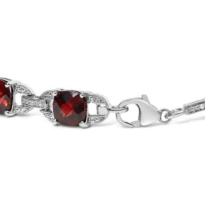 Close-up side angle of a white metal bracelet featuring cushion-shaped red gemstones and round white gemstones in prong settings, with a lobster claw clasp.