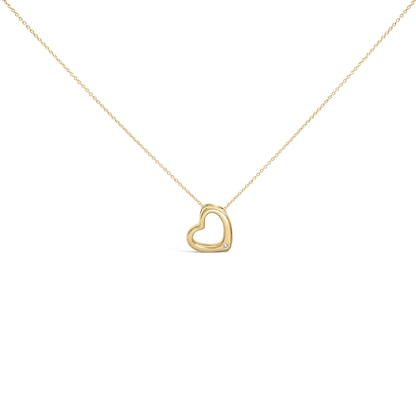Front angle view of a yellow necklace with an open heart-shaped pendant featuring a single round white gemstone in a bezel setting near the bottom, shown on a white background.