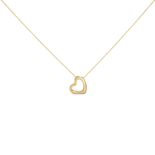 Front angle view of a yellow necklace with an open heart-shaped pendant featuring a single round white gemstone in a bezel setting near the bottom, shown on a white background.
