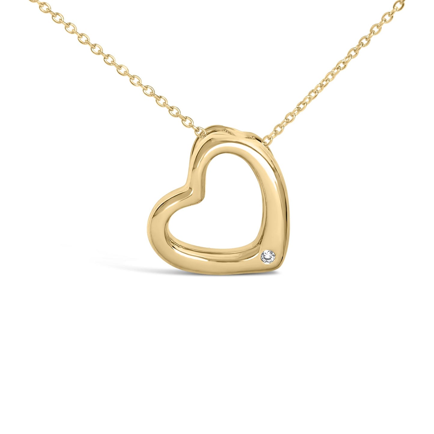 Close-up view of a yellow metal heart-shaped necklace pendant with an open center and a single round white gemstone set in the bezel near the bottom right, shown on a white background.