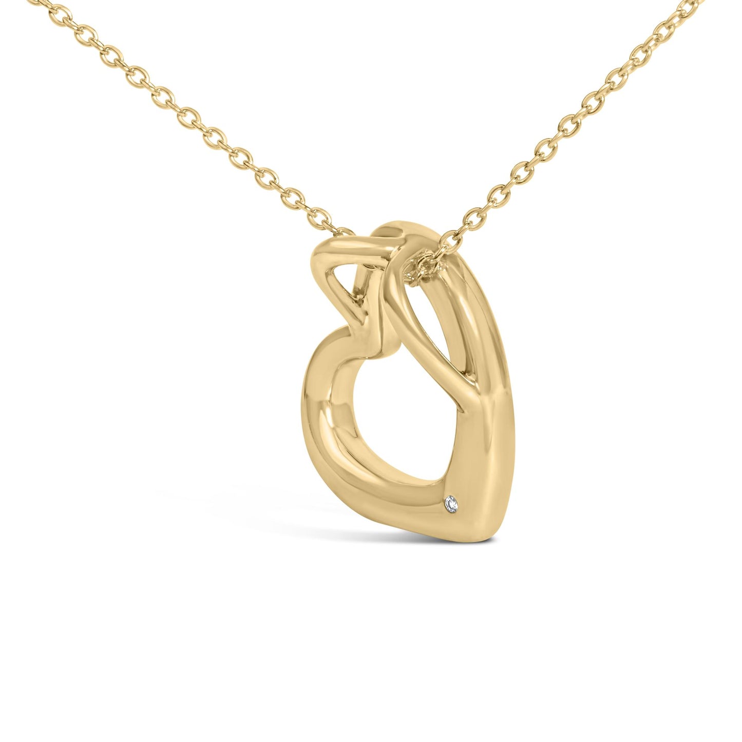 Close-up angled view of a yellow metal necklace with an interlocking heart-shaped pendant featuring a small round white gemstone in a bezel setting near the bottom.
