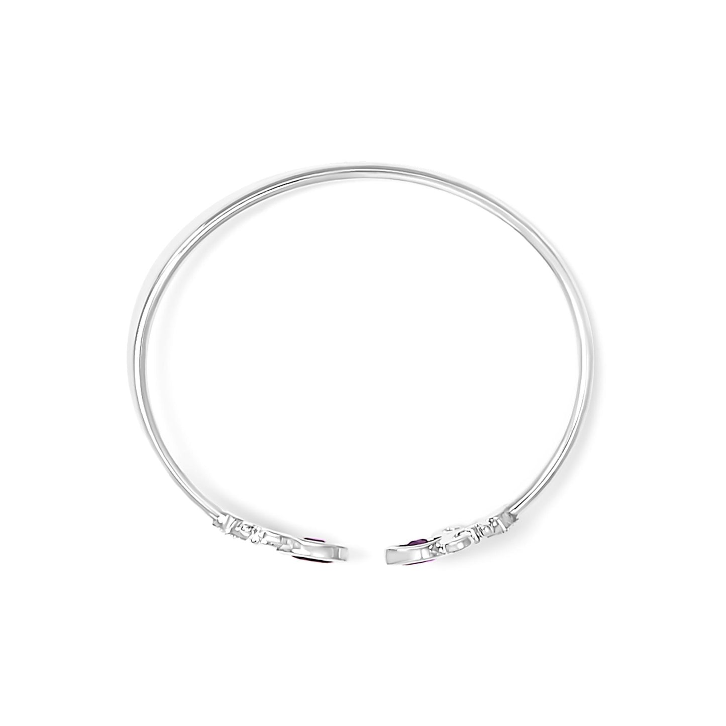 White metal open cuff bracelet shown from above, featuring round white gemstones in pave setting and two purple marquise-shaped gemstones in bezel setting near the ends.