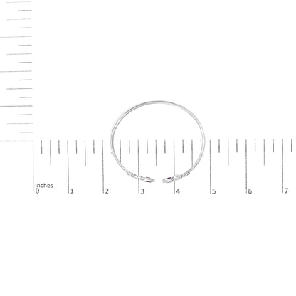 White-colored bracelet with two open ends, each end featuring a purple marquise-shaped gemstone in bezel setting surrounded by small round white gemstones in pave setting, shown on a measurement scale, top-down view.