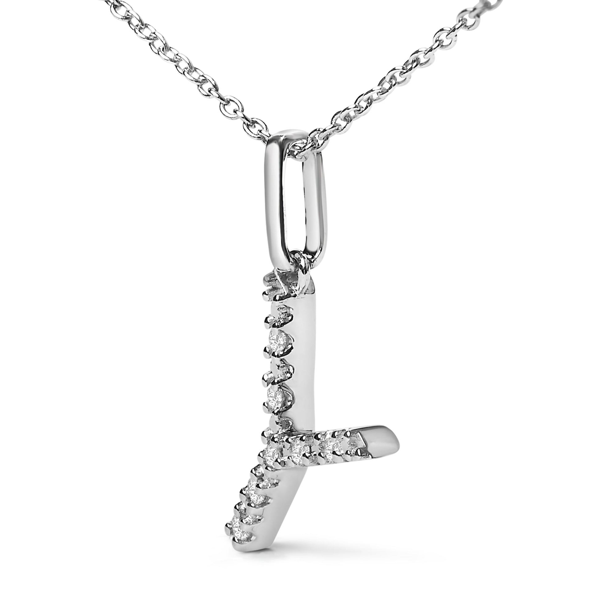 Close-up front angle of a white metal necklace pendant in the shape of the letter 'L' adorned with round white gemstones in a micro-pave setting, hanging from a chain with oval links.