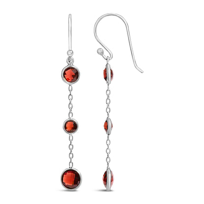Front and side views of white metal dangling earrings with three bezel-set round red gemstones connected by small chain links.
