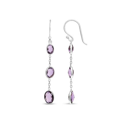 Front and side view of white metal drop earrings featuring three oval purple gemstones in bezel settings connected by small links.