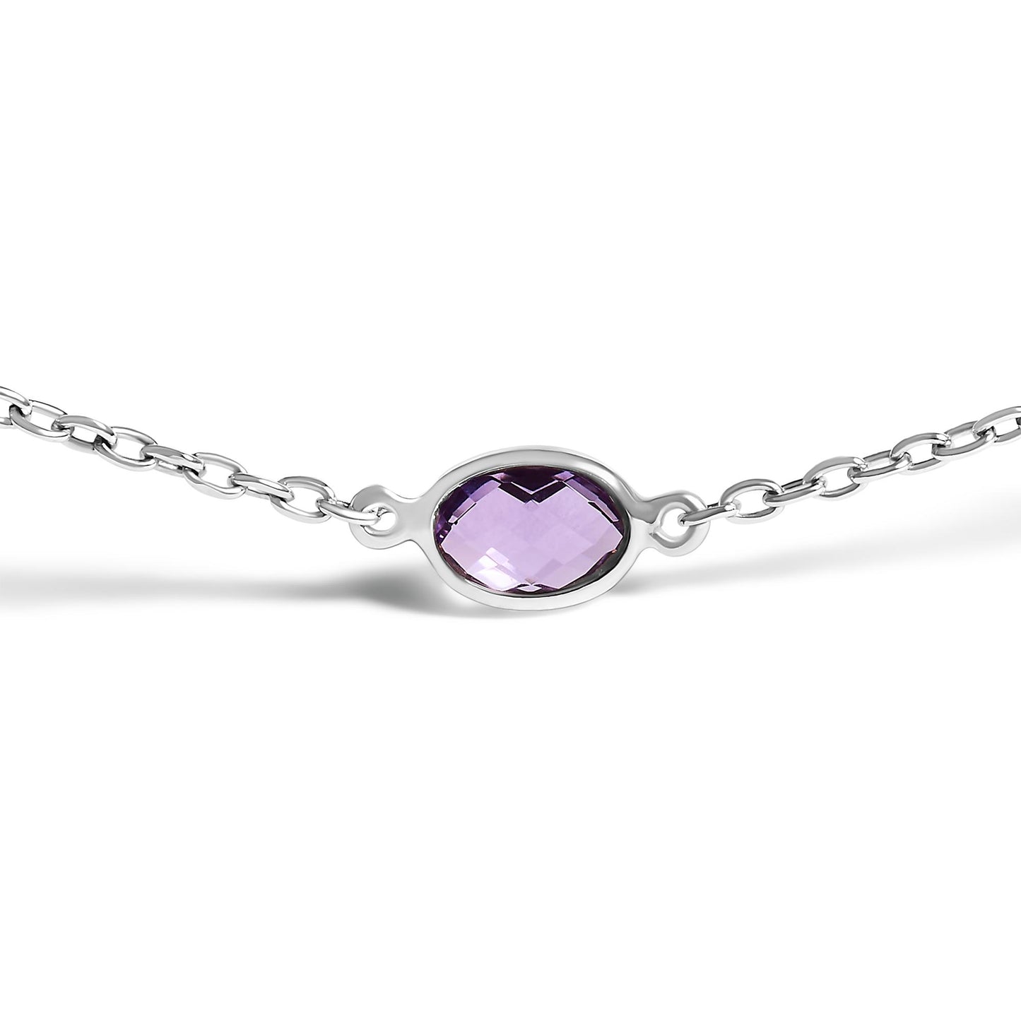 Close-up front angle of a white metal necklace with an oval-shaped purple gemstone in a bezel setting at the center of a chain.