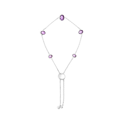 Top-down view of a white metal bracelet with several oval purple gemstones set in bezels connected by a delicate chain, featuring an adjustable sliding clasp with two small round metal ends.