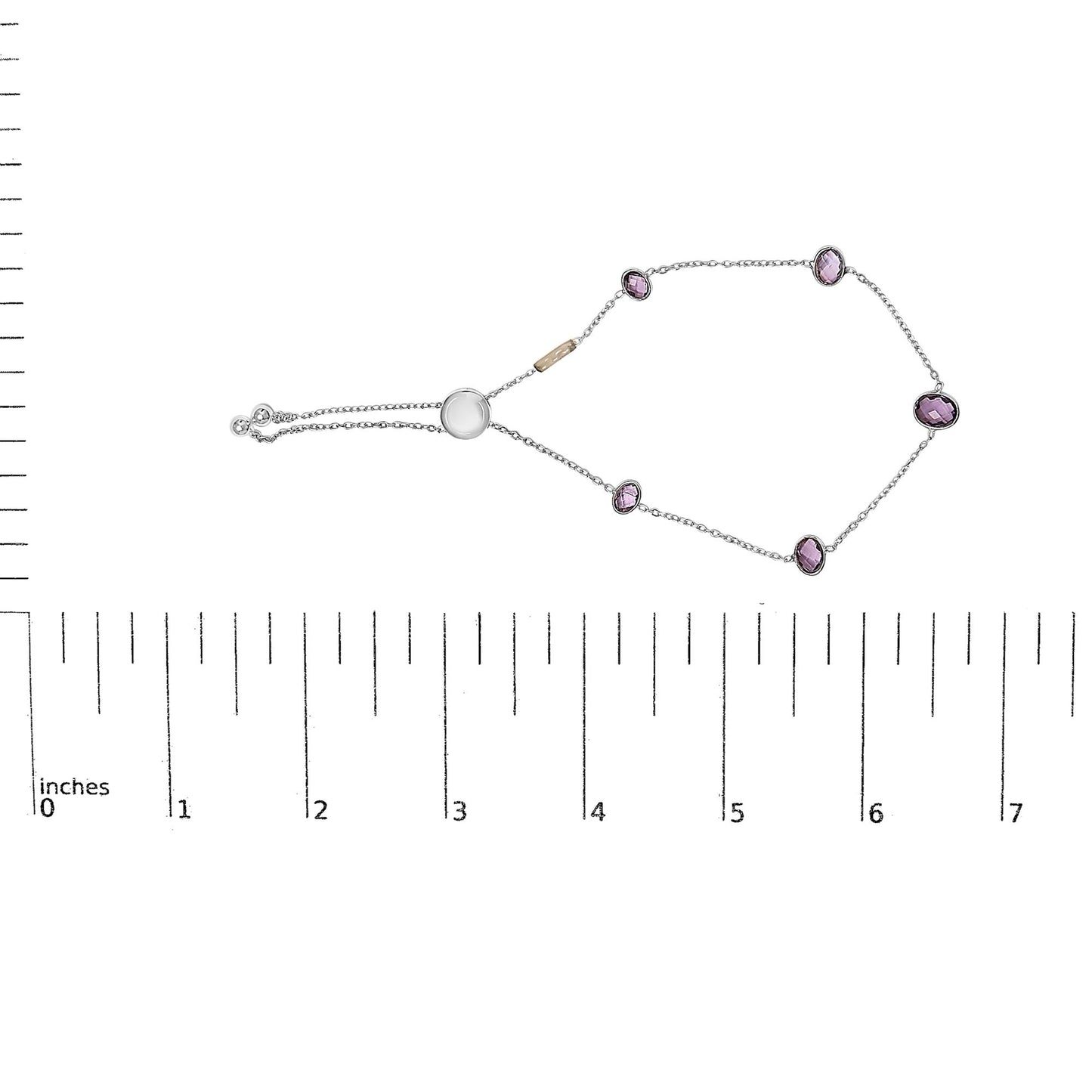 White metal bracelet with oval purple gemstones in bezel settings, displayed flat on a ruler shot from above.