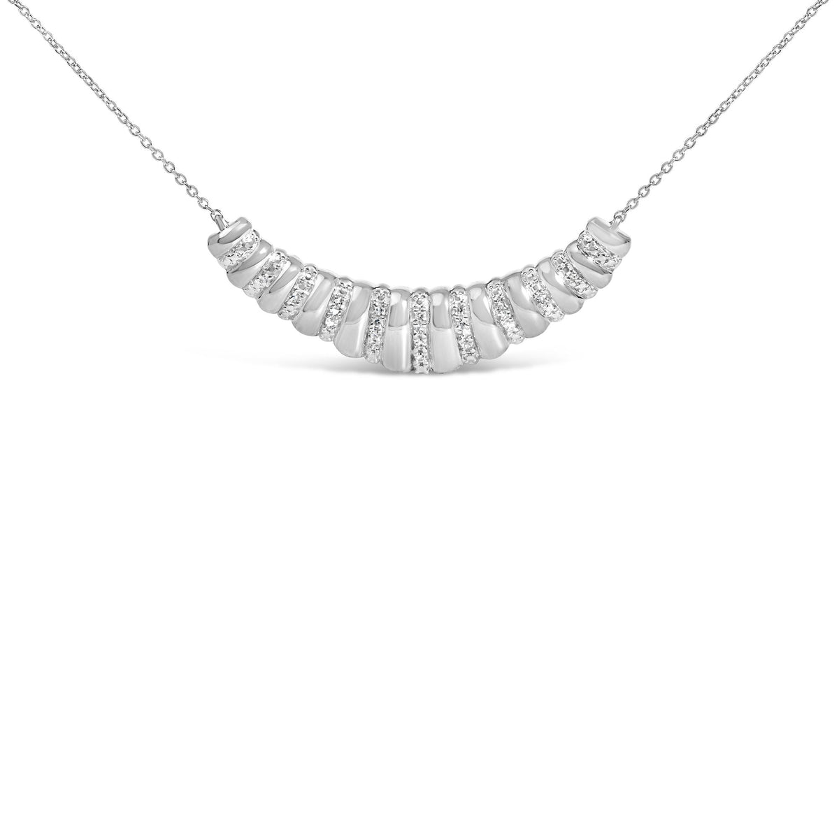 Close-up front view of a white metal necklace with a curved pendant featuring multiple rows of round white gemstones in pave setting.