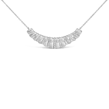 Close-up front view of a white metal necklace with a curved pendant featuring multiple rows of round white gemstones in pave setting.