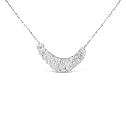 Close-up front view of a white necklace with a curved segmented pendant featuring white gemstones in pave settings, shown on a white background.