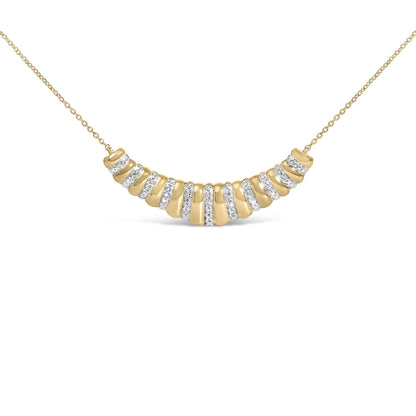 Close-up front angle of a yellow necklace with a chain and a curved pendant featuring alternating smooth sections and sections paved with white gemstones.