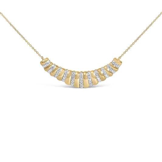 Close-up front angle of a yellow necklace with a chain and a curved pendant featuring alternating smooth sections and sections paved with white gemstones.