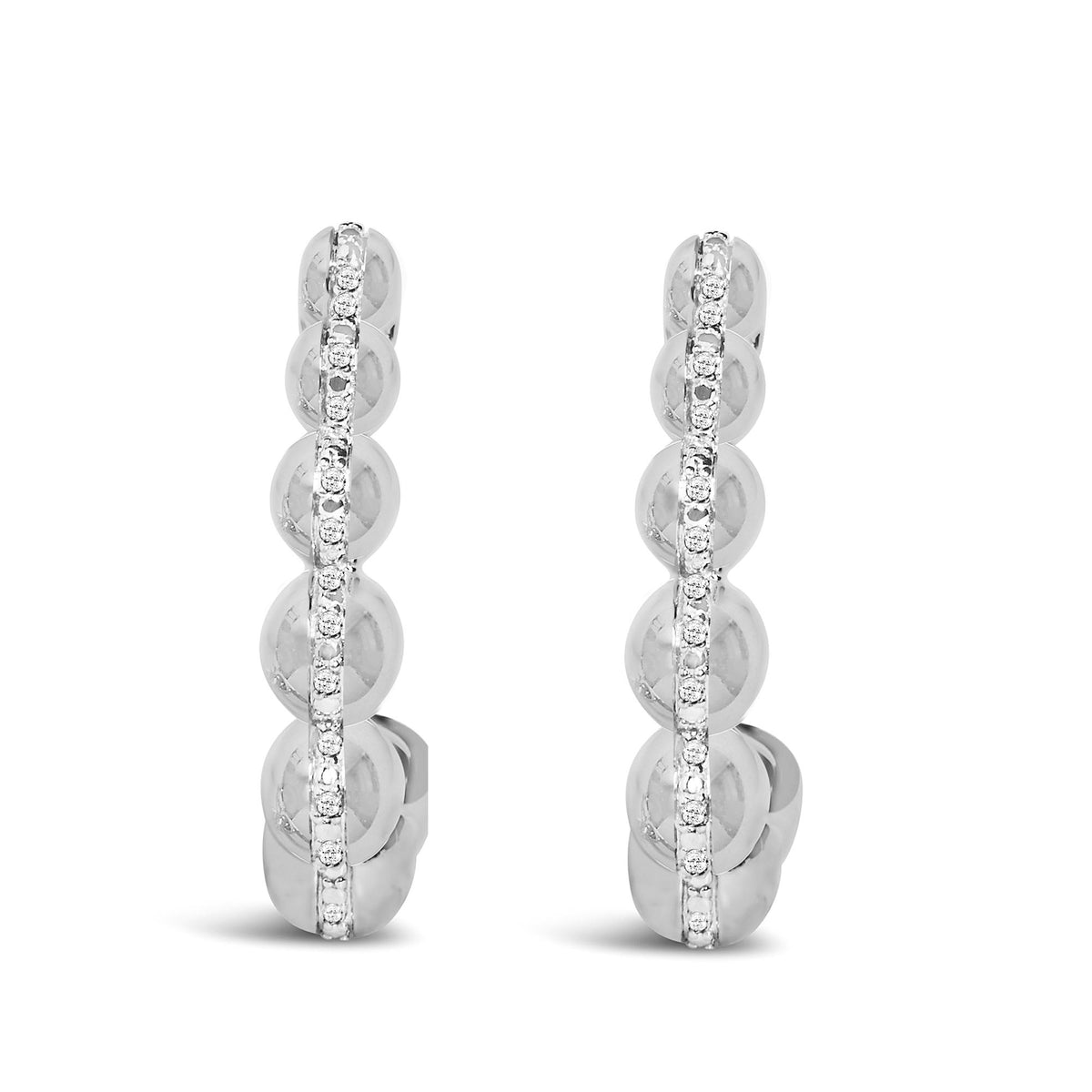 Close-up front view of a pair of white metal hoop earrings with a vertical row of round white gemstones in pave setting. The earrings are shown side by side on a white background.
