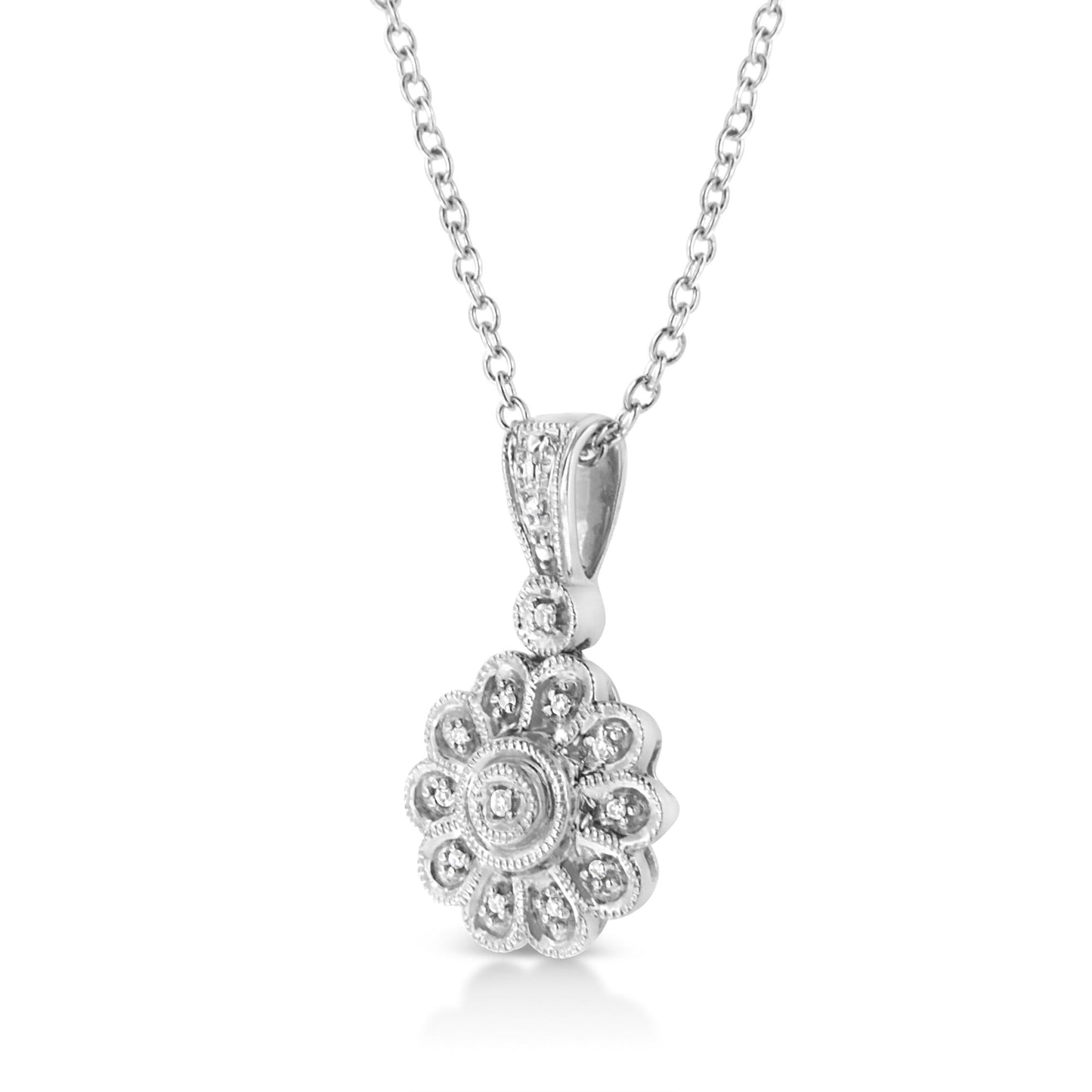 Close-up front angle of a white metal necklace with a flower-shaped pendant featuring round white gemstones in a pavé setting.